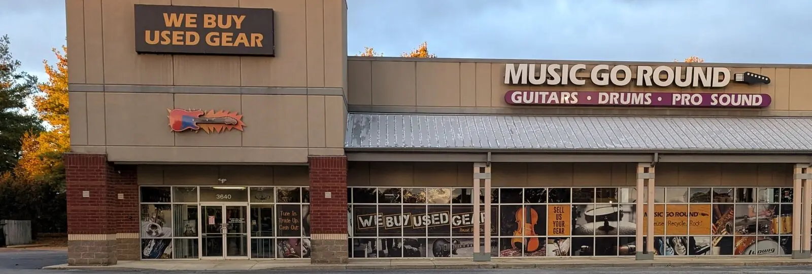 Music Go Round Louisville storefront with a large WE BUY USED GEAR sign